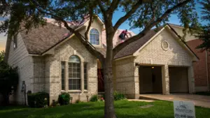 Professional installation of roofing underlayment on a residential home in San Antonio, Texas, providing roof deck protection before shingles are installed.